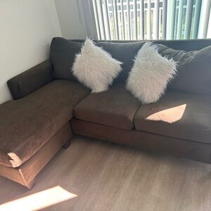 Brown Sectional Sofa with Cream Accent Pillows